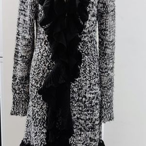 Long sweater with ruffled neck